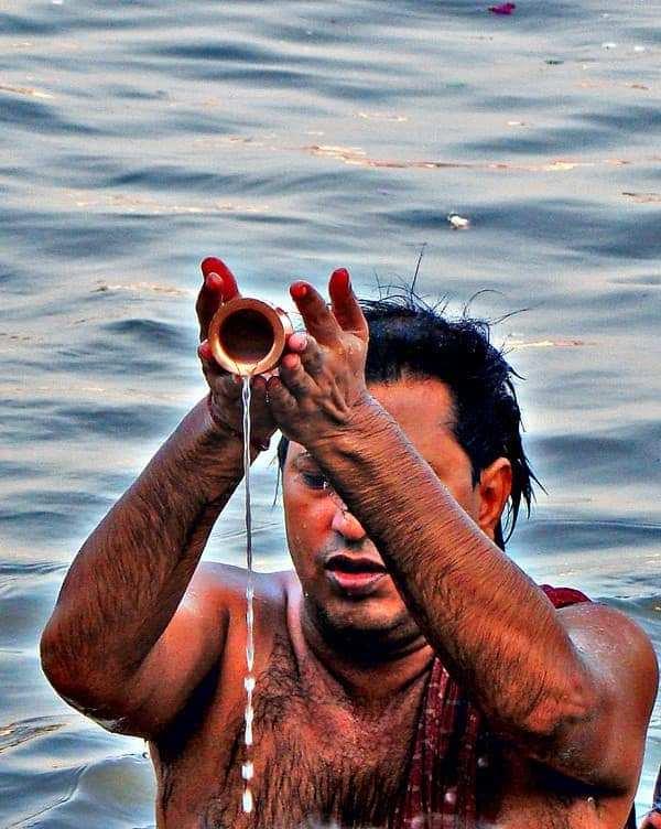 Devotee offering tarpan